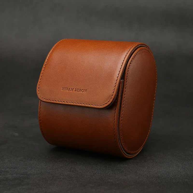 Brown vegetable tanned case with 'Hiram Beron' branding on a dark background