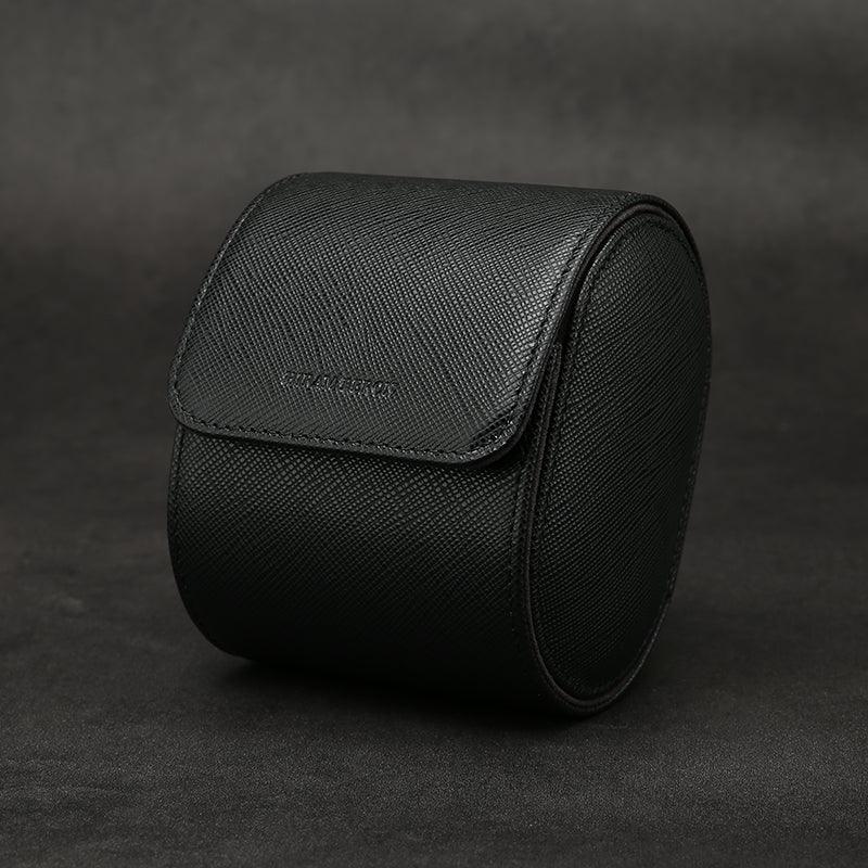 Black saffino leather watch roll on a dark background