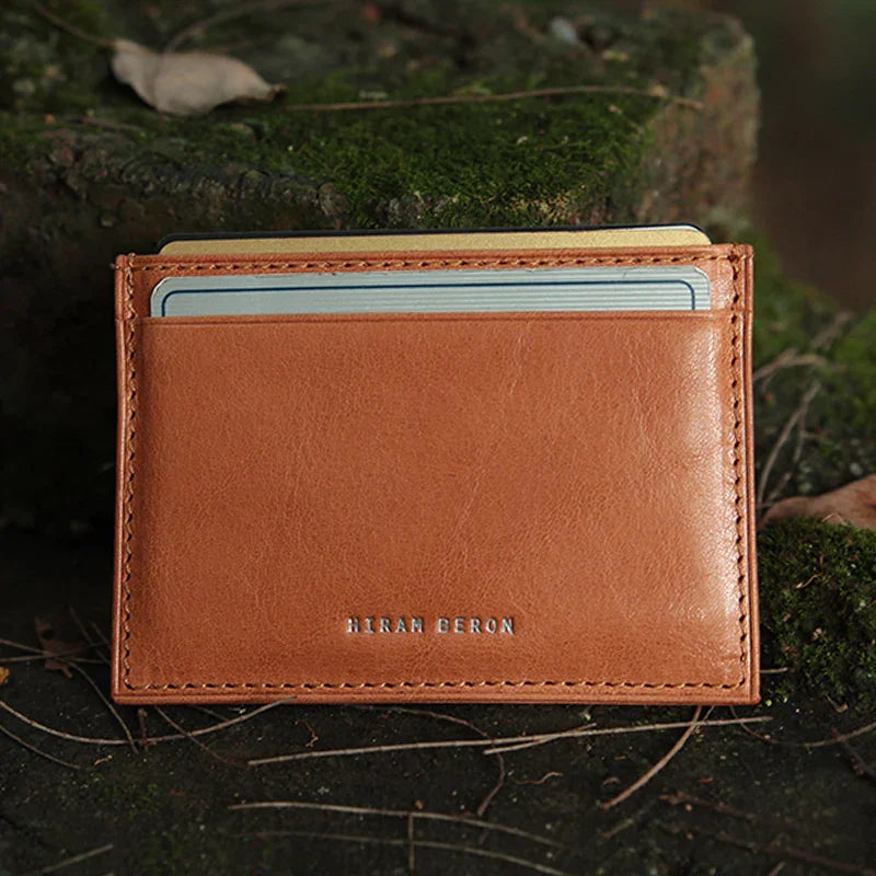 tan vegetbale tanned leather cardholder with card slots on a natural background