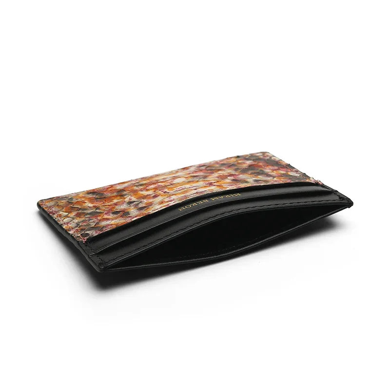 the detail of the top pocket of the python skin card holder