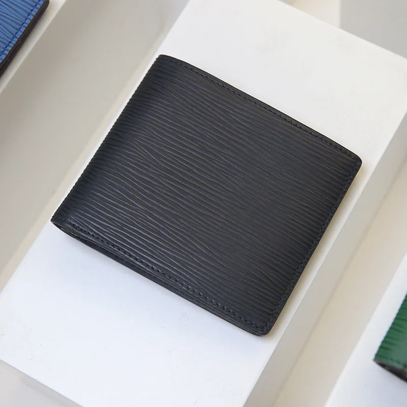 Black wave pattern bifold wallet on a white surface