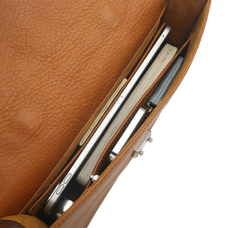 Brown leather tablet briefcases with a laptop and documents inside
