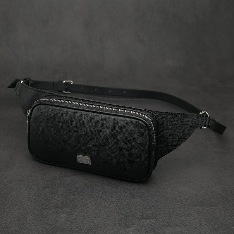 Black saffiano leather belt bag on a dark gray background