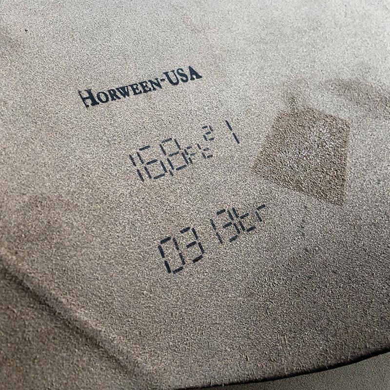 Close-up of a textured surface with 'Horween USA' branding and numbers.