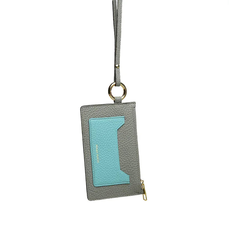 Light grey cardholder with a turquoise pocket on a white background