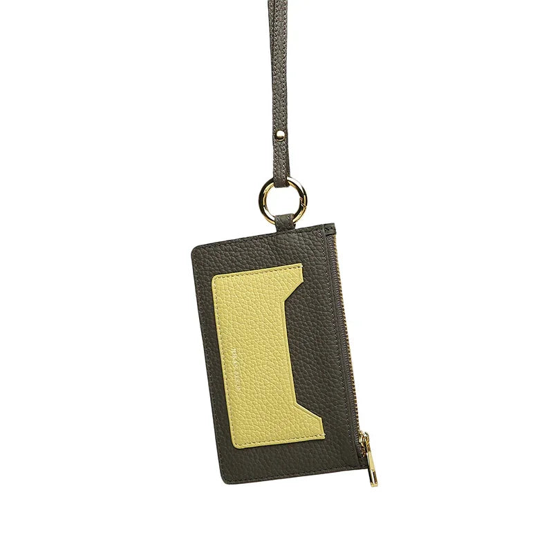 grey and yellow leather zipper card case with gold accent on a white background