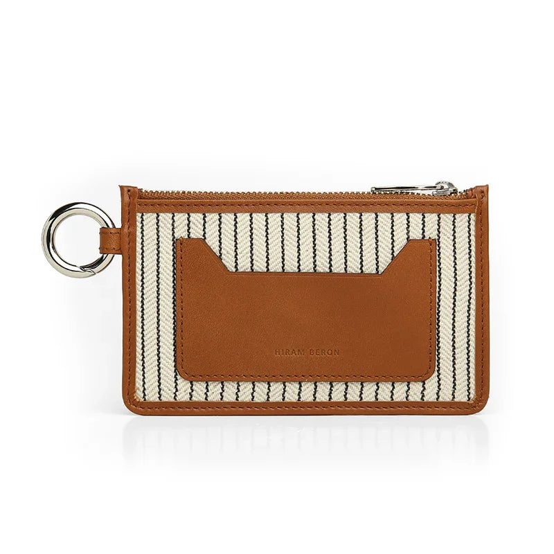 Striped wallet with brown leather card holder on a white background