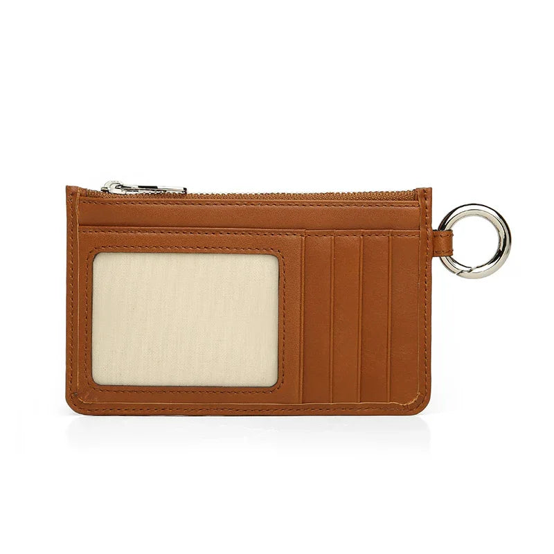 Brown leather cardholder with a key ring on a white background