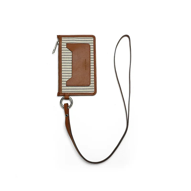 Brown pouch with a strap on a white background