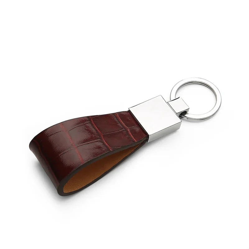 high-quality silver-tone metal ring on a leather key chain