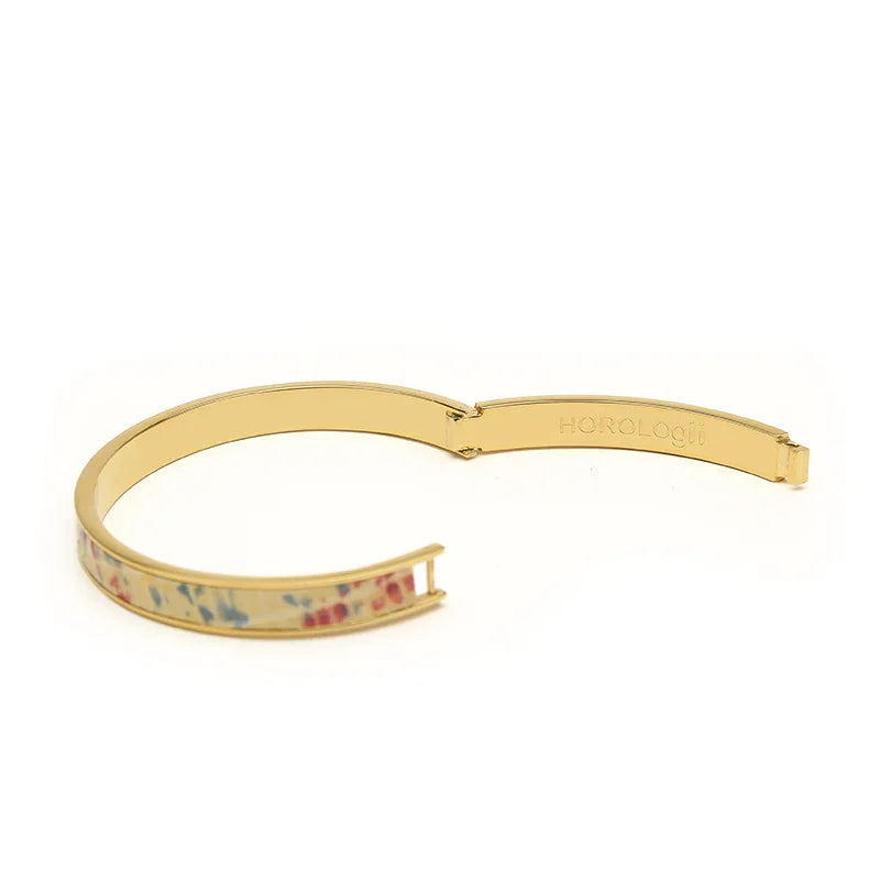 Gold bangle bracelet with floral enamel design, Horologii engraved on inner band