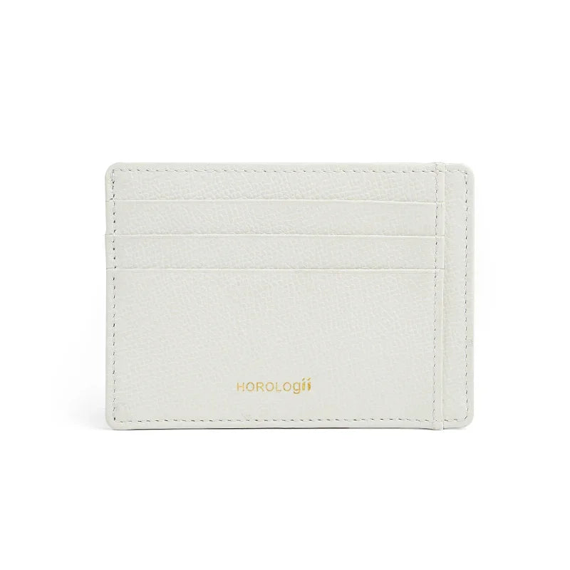 White epsom leather cardholder with 'Horologii' branding on a white background
