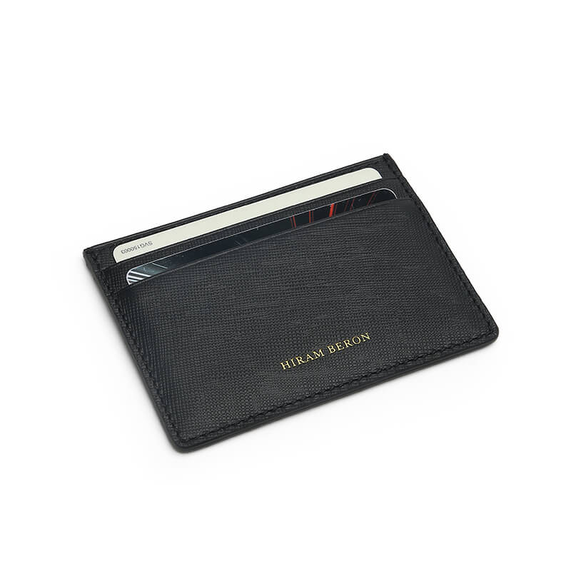 Close-up of the edge of card holder,thin,black saffiano leather,HIRAM BERON leather atelier.