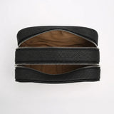 Black leather dopp kit with two zippers on a white background