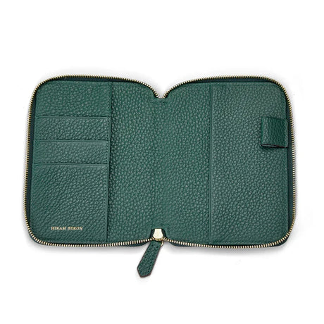 Green pebble leather zippered passport wallet on a white background