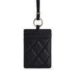 Black quilted leather ID card holder with gold ring and strap, luxury accessory for work or travel