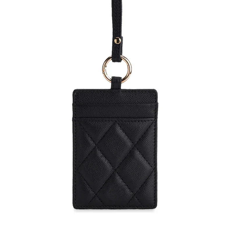 Black quilted leather ID card holder with gold ring and strap, luxury accessory for work or travel
