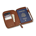 Brown pebble leather passport wallet with passport, card, and money on a white background