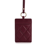 Burgundy quilted leather ID card holder with gold ring and strap, luxury accessory