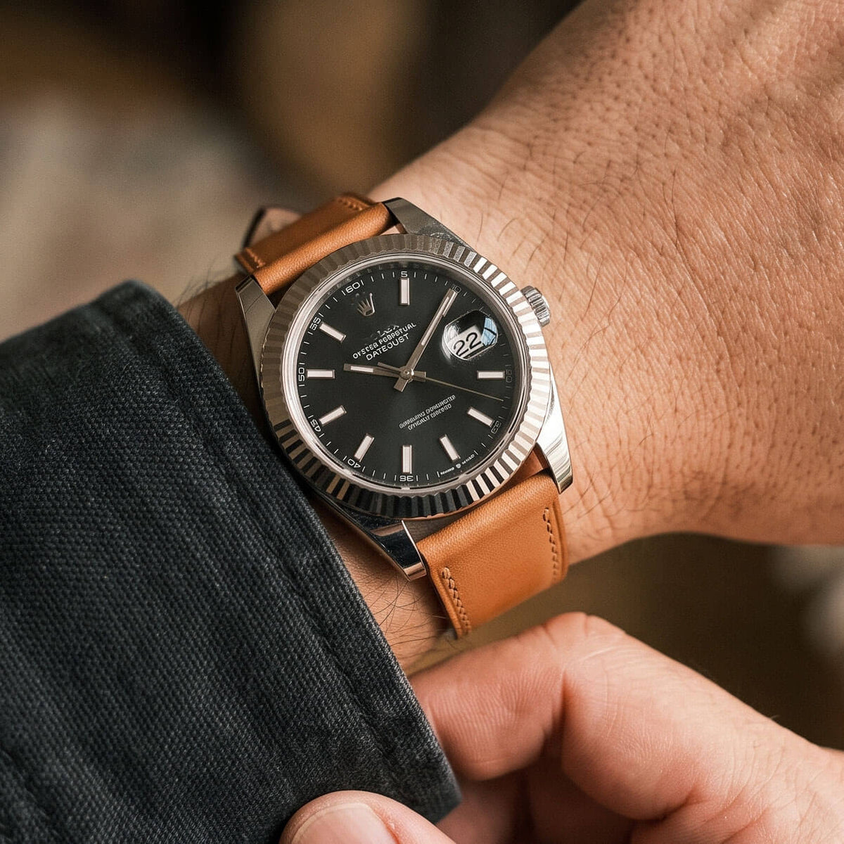 Wrist shot of 1.8mm ultra thin flat Italian calfskin watch band in light brown paired with fluted bezel watch