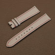 Pair of 1.8mm flat Beige White Alran chèvre leather watch bands showing red perimeter stitch detail