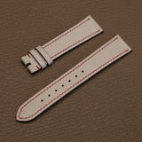 Pair of 1.8mm flat Beige White Alran chèvre leather watch bands showing red perimeter stitch detail