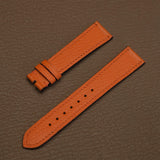 Pair of tailored French Alran goat leather watch bands in orange showing 115mm by 75mm flat profile
