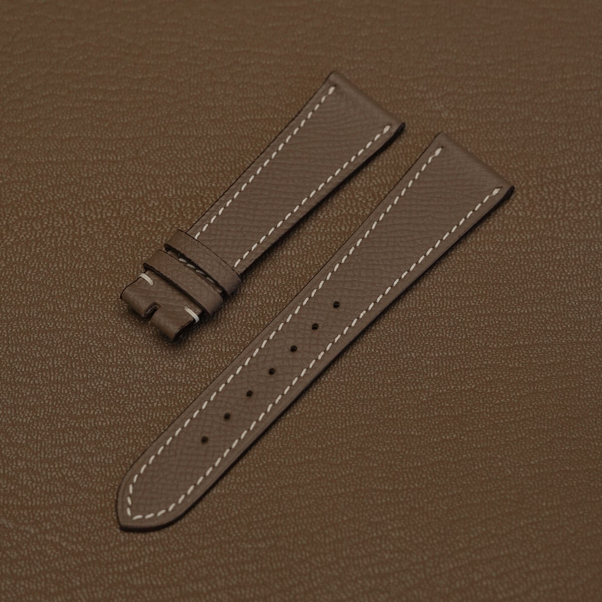 Pair of Etoupe French Epsom grain watch bands showing 115mm by 75mm tailored dimensions