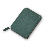 Green pebble leather passport wallet on a white background