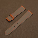 Light grey waterproof Haas Zermatt lining on custom goatskin watch strap with orange perimeter stitching