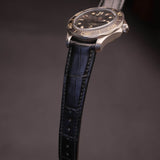 Macro detail shot of matte black French HCP alligator leather showing pristine natural symmetrical bamboo scale texture.