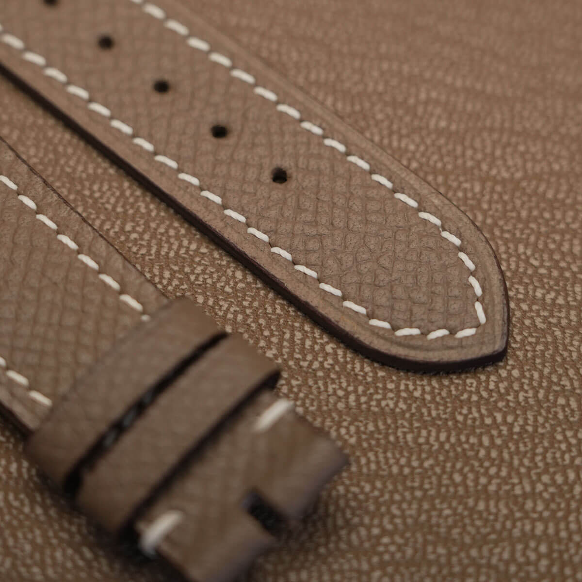 Close-up texture of French Epsom grain calfskin watch strap showing precision edge finishing