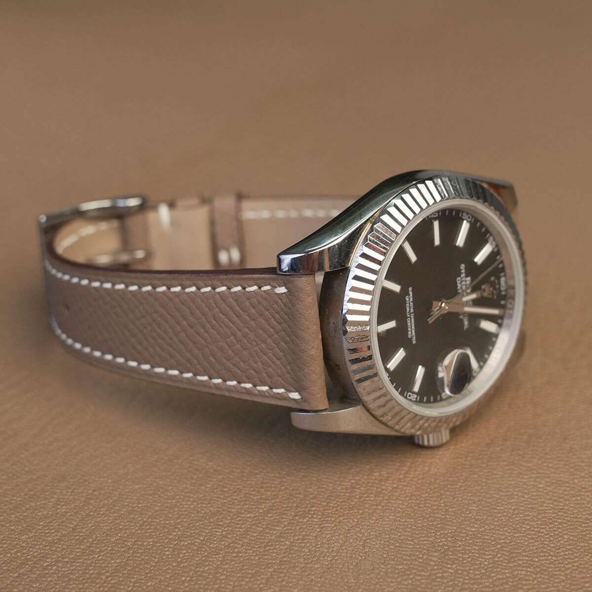 Side profile of 1.8mm flat Etoupe Epsom leather watch strap highlighting neat sealed edges