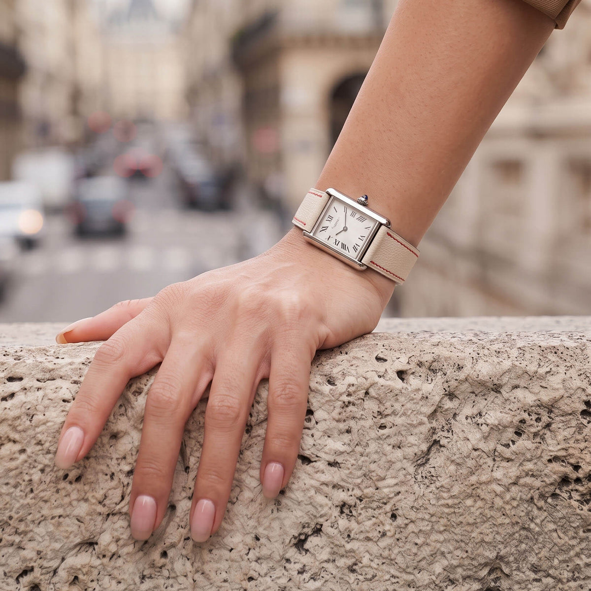 On-wrist lifestyle view of Beige White French Alran goatskin watch band fitted on steel tank watch