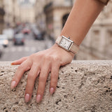 On-wrist lifestyle view of Beige White French Alran goatskin watch band fitted on steel tank watch