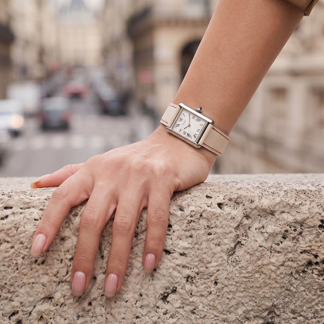 On-wrist lifestyle view of Beige White French Alran goatskin watch band fitted on steel tank watch