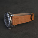 Light brown French Epsom calfskin watch strap fitted on steel luxury watch case side view