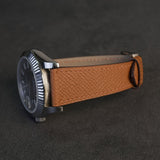 Light brown French Epsom calfskin watch strap fitted on steel luxury watch case side view