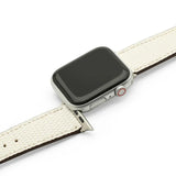 Smartwatch with a white lizard skin leather watch strap on a white background