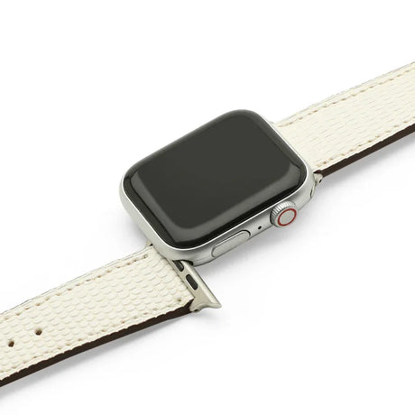 Smartwatch with a white lizard skin leather watch strap on a white background
