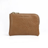 beige leather coin pouch with 'Hiram Beron' branding on a white background