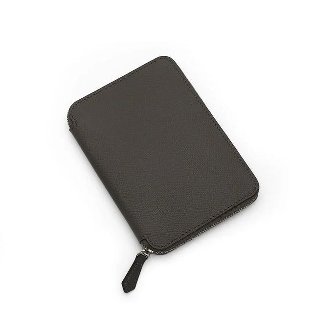 Grey Epsom leather passport wallet on a white background