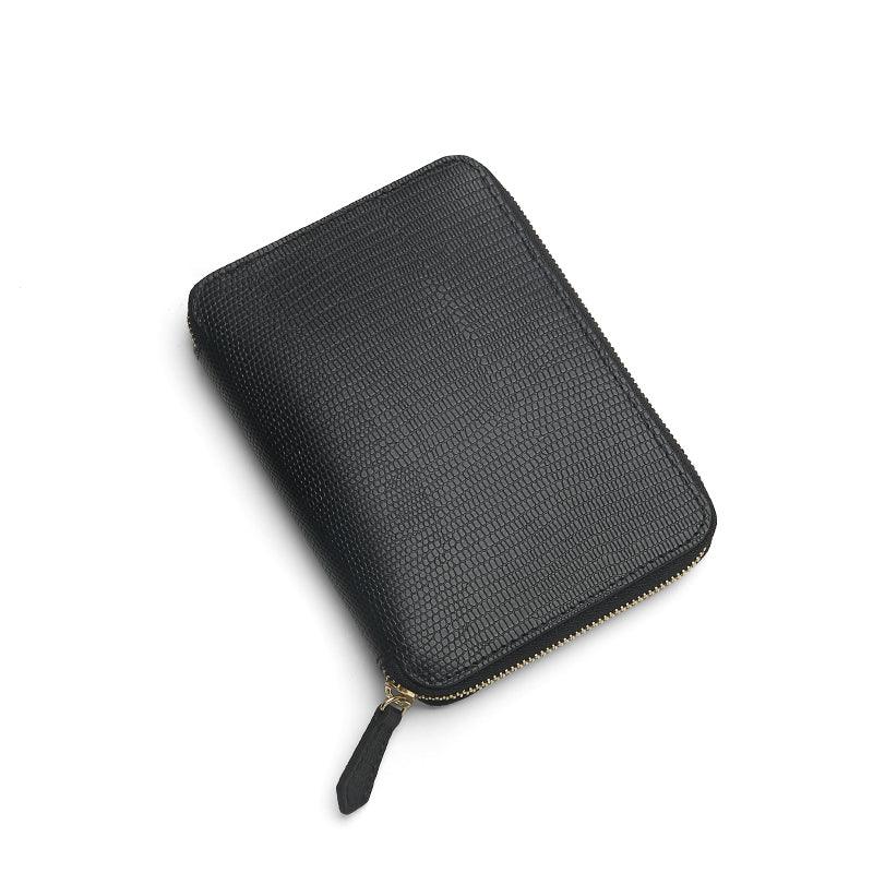 Black lizard pattern leather passport wallet  on a white background