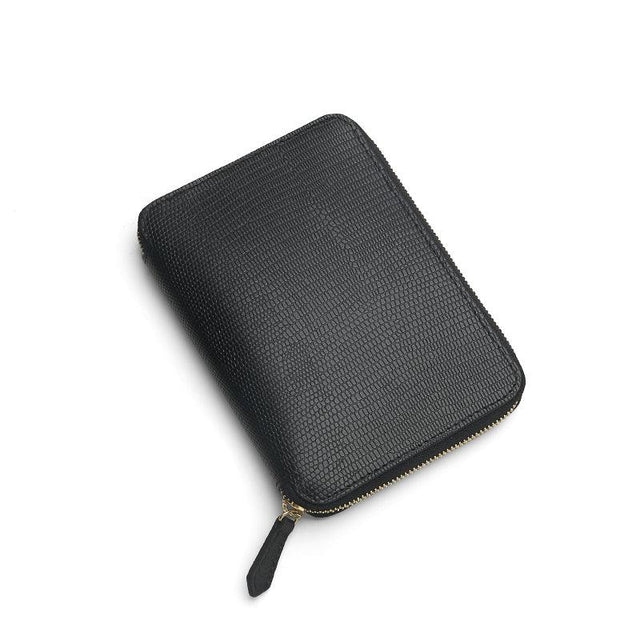 Black lizard pattern leather passport wallet  on a white background