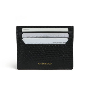 Black python skin cardholder with 'Hiram Beron' branding on a white background