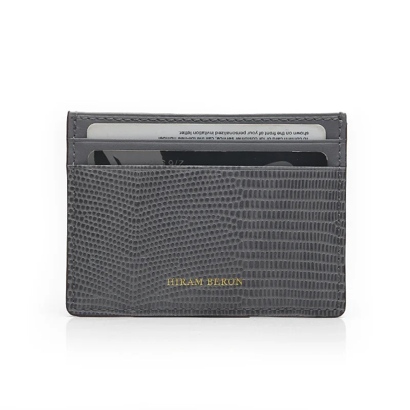 Gray lizard pattern cardholder with 'Hiram Beran' branding on a white background