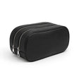 Black leather toiletry bag with zippers on a white background