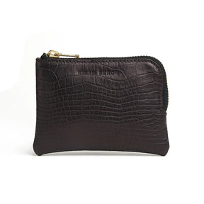Black leather aligator pattern coin pouch with gold zipper on a white background