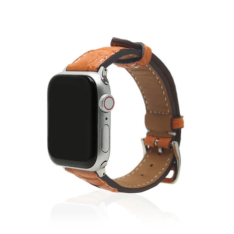 Smartwatch with a orange leather strap on a white background