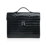 Black crocodile-patterned leather business folios with handle on a white background